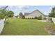 Spacious backyard with grassy area and a white picket fence at 1225 White Fox Ct., Conway, SC 29526