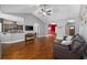 Spacious living room featuring hardwood floors and access to kitchen and dining areas at 1225 White Fox Ct., Conway, SC 29526
