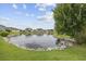 Serene pond view with stone border, offering a tranquil setting at 1225 White Fox Ct., Conway, SC 29526