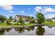 Beautiful pond view reflecting house and lush greenery at 1225 White Fox Ct., Conway, SC 29526