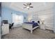 Spacious bedroom with a built-in desk and wood-like accent wall at 1225 White Fox Ct., Conway, SC 29526