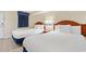 Bedroom with two twin beds, nightstand, and dark blue curtains at 2300 N Ocean Blvd. # 238, Myrtle Beach, SC 29577