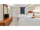 Bedroom with two beds, dresser, TV, and ocean view at 2300 N Ocean Blvd. # 238, Myrtle Beach, SC 29577