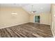 Bright living room with hardwood floors, access to balcony, and vaulted ceiling at 125 S Shore Blvd. # 302, Longs, SC 29568