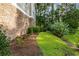 Landscaped area with stone wall and lush greenery at 125 S Shore Blvd. # 302, Longs, SC 29568