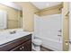 Clean bathroom with a shower/tub combo, double vanity, and dark brown cabinets at 125 S Shore Blvd. # 302, Longs, SC 29568