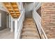 Exterior staircase with wooden steps and white railings at 125 S Shore Blvd. # 302, Longs, SC 29568