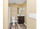 Simple bathroom with shower/tub combo, toilet and dark vanity at 125 S Shore Blvd. # 302, Longs, SC 29568