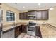 Modern kitchen with stainless steel appliances and granite countertops at 125 S Shore Blvd. # 302, Longs, SC 29568