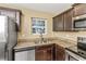 Modern kitchen with stainless steel appliances and granite countertops at 125 S Shore Blvd. # 302, Longs, SC 29568