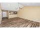Open living room with hardwood floors, high ceilings and kitchen views at 125 S Shore Blvd. # 302, Longs, SC 29568