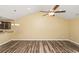 Spacious living room featuring hardwood floors, vaulted ceilings, and ceiling fan at 125 S Shore Blvd. # 302, Longs, SC 29568