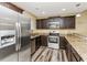 Modern kitchen featuring stainless steel appliances and granite countertops at 125 S Shore Blvd. # 302, Longs, SC 29568