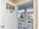 Open door reveals a view of a balcony overlooking a residential complex at 125 S Shore Blvd. # 302, Longs, SC 29568