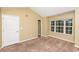 Spacious bedroom with carpeted floor, large window, and ample closet space at 125 S Shore Blvd. # 302, Longs, SC 29568