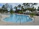 Relaxing kidney-shaped pool with surrounding patio at 108 Hallandale Lane, Murrells Inlet, SC 29576