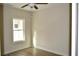 A bright bedroom with wood flooring and a ceiling fan at 108 Hallandale Lane, Murrells Inlet, SC 29576