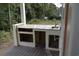 An outdoor kitchen with granite countertops and a sink at 108 Hallandale Lane, Murrells Inlet, SC 29576
