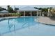 Community pool with lounge chairs and covered seating area at 108 Hallandale Lane, Murrells Inlet, SC 29576