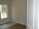 A bright bedroom with wood flooring and a window at 108 Hallandale Lane, Murrells Inlet, SC 29576