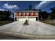 Two-unit building with attached garages and landscaping at 108 Hallandale Lane, Murrells Inlet, SC 29576