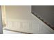 A staircase with wainscoting and wood stairs at 108 Hallandale Lane, Murrells Inlet, SC 29576