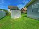Gray storage shed in a grassy backyard at 312 13Th Ave. S, Surfside Beach, SC 29575