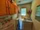 Laundry room with washer, dryer, and storage cabinets at 312 13Th Ave. S, Surfside Beach, SC 29575