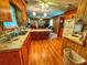 Kitchen with wood cabinets, island and wood flooring at 312 13Th Ave. S, Surfside Beach, SC 29575