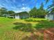 Gray house exterior with a spacious green yard at 312 13Th Ave. S, Surfside Beach, SC 29575