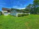 Gray house exterior with green lawn and AC unit at 312 13Th Ave. S, Surfside Beach, SC 29575