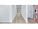 Bright hallway with light gray walls and wood-look flooring at 7077 Watercress St, Myrtle Beach, SC 29579