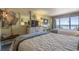 Beach-themed bedroom with two twin beds, ocean view, and dresser at 2311 Ocean Blvd. S # 361, Myrtle Beach, SC 29577