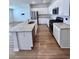 Modern kitchen with white cabinets, granite countertops, and stainless steel appliances at 163 Marsh Deer Place, Surfside Beach, SC 29575
