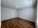 Spacious bedroom with wood-look flooring and neutral walls at 163 Marsh Deer Place, Surfside Beach, SC 29575