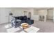 Bright loft area features a comfortable sectional sofa and plenty of natural light at 7043 Shooting Star Way, Myrtle Beach, SC 29579