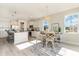 Modern kitchen with island, stainless steel appliances, and granite countertops at 7043 Shooting Star Way, Myrtle Beach, SC 29579