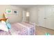 Bedroom with metal bed frame and double doors to closet at 7043 Shooting Star Way, Myrtle Beach, SC 29579
