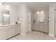 Double vanity bathroom with modern fixtures and a large mirror at 7043 Shooting Star Way, Myrtle Beach, SC 29579