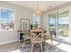 Bright breakfast nook with table and chairs, near sliding glass doors at 7043 Shooting Star Way, Myrtle Beach, SC 29579