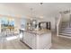 Open concept kitchen with island, granite countertops, and stainless steel appliances at 7043 Shooting Star Way, Myrtle Beach, SC 29579