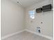 Bright laundry room with tile flooring and shelving at 7043 Shooting Star Way, Myrtle Beach, SC 29579
