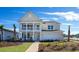 Two-story home with front porch and balcony at 7043 Shooting Star Way, Myrtle Beach, SC 29579