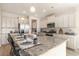 Kitchen island with granite countertop and seating for four at 7043 Shooting Star Way, Myrtle Beach, SC 29579