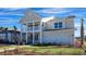 Two story house with front porch and attached two car garage at 7043 Shooting Star Way, Myrtle Beach, SC 29579