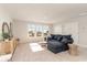 Spacious bonus room with L-shaped sectional sofa and large windows at 7043 Shooting Star Way, Myrtle Beach, SC 29579