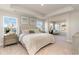 Spacious main bedroom with a king-size bed and water views at 7043 Shooting Star Way, Myrtle Beach, SC 29579
