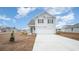 Two-story home with gray siding, white garage door, and landscaped yard at 580 Black Pearl Way, Myrtle Beach, SC 29588