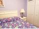 bedroom with white furniture and purple floral bedding at 160 Lazy Willow Ln. # 204, Myrtle Beach, SC 29588