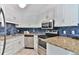 Modern kitchen with granite countertops and stainless steel appliances at 2805 N Ocean Blvd. # 301, Myrtle Beach, SC 29577